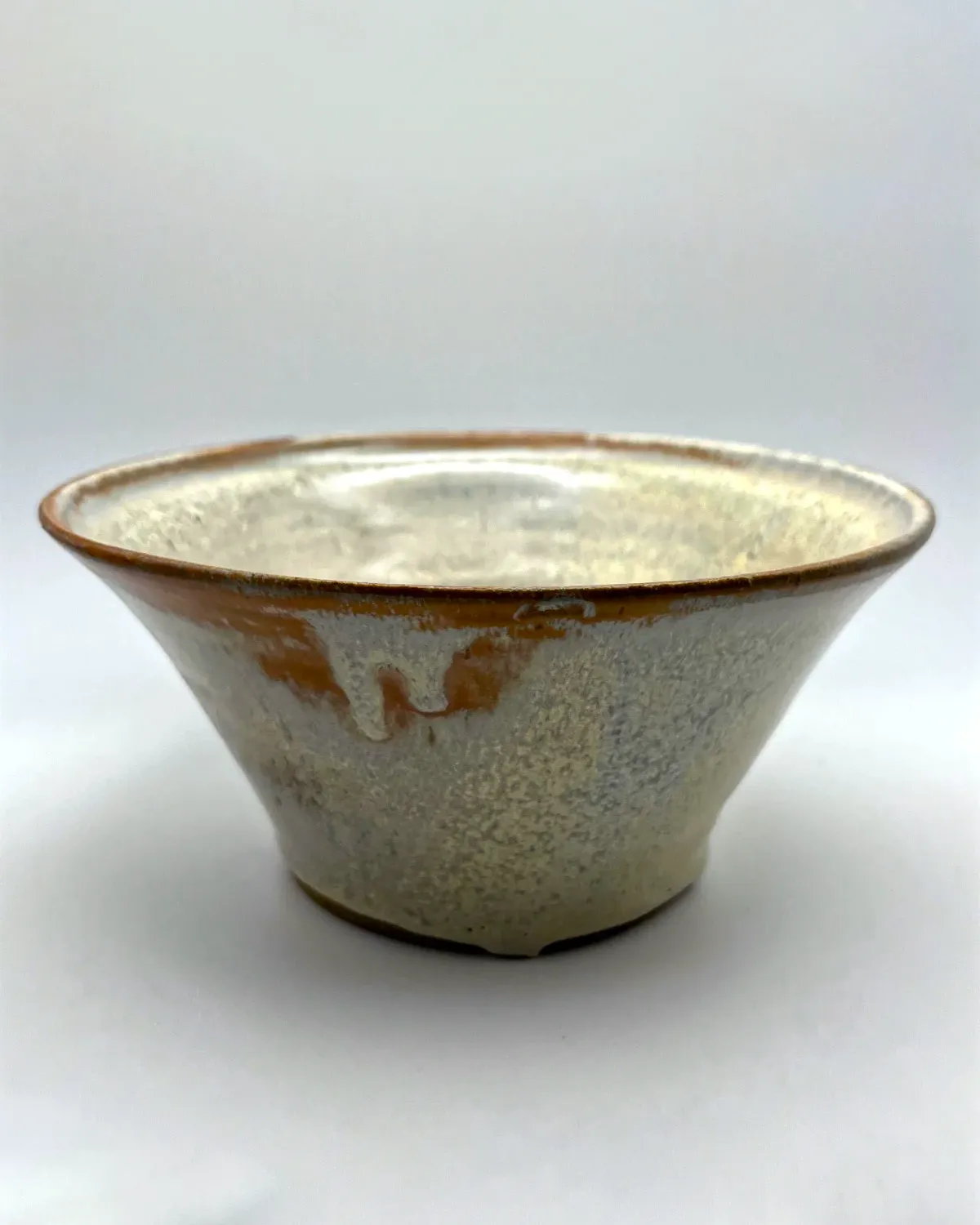 A stoneware speckled bowl
