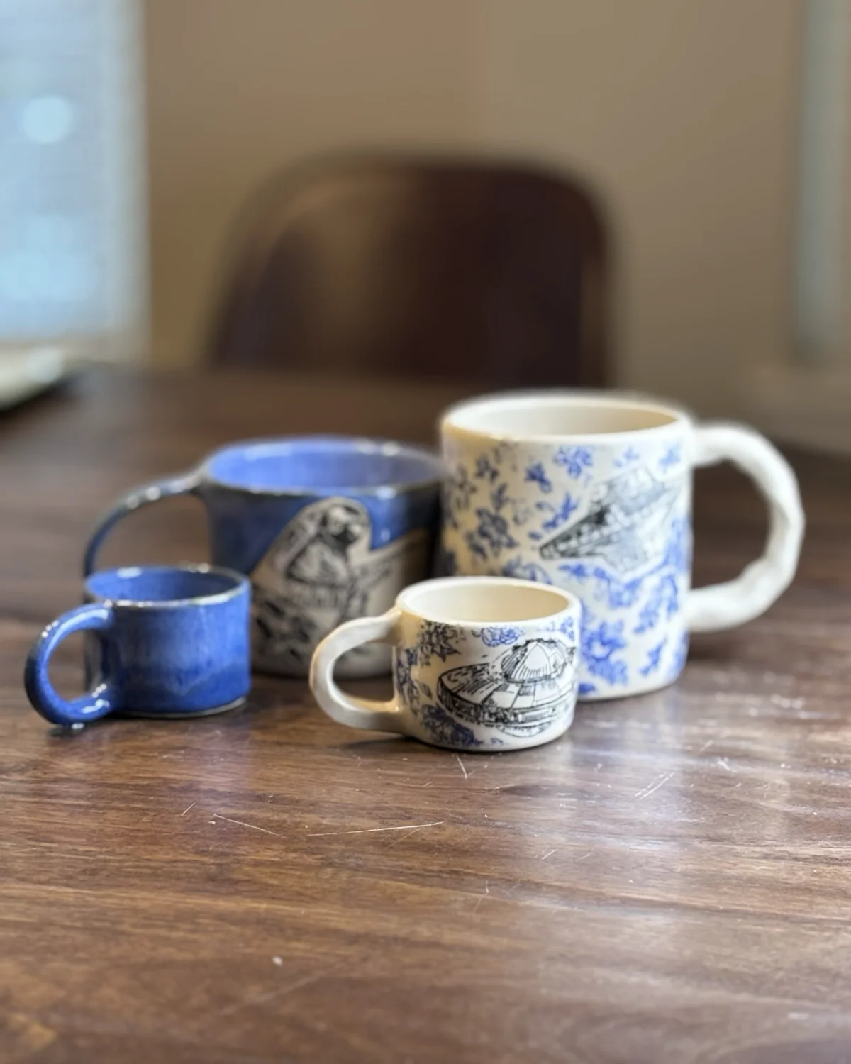 A small set that includes two mugs and two espresso cups.